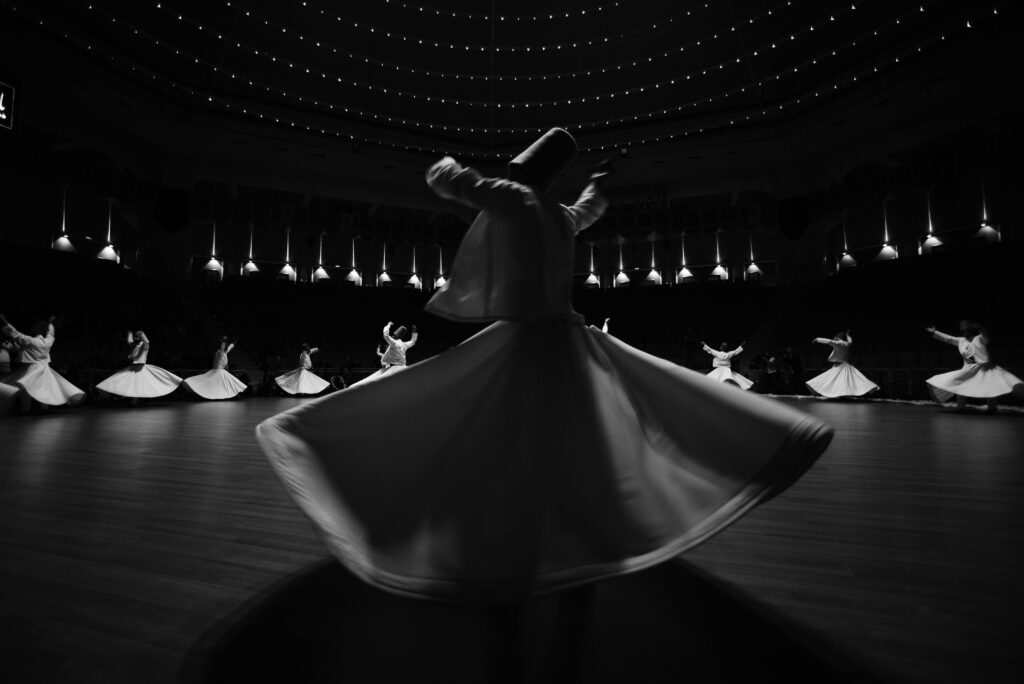 Photo by Hayati Ayrancı: https://www.pexels.com/photo/dervishes-dancing-on-stage-27139559/